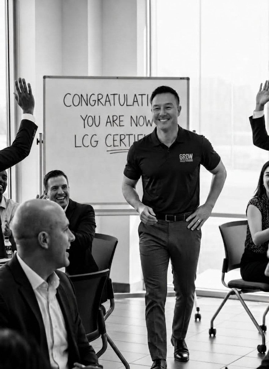 Lambo Borgardt smiling in front of a whiteboard that reads "Congratulations, you are now LCG Certified" while sales reps raise their hands